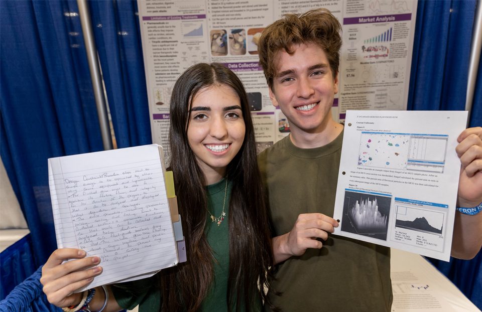 ISEF finalists presenting their research poster